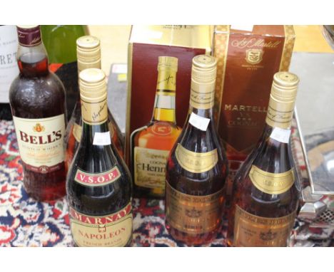 Cognac including Martell VS, Jules Domet VSOP Napoleon, Marnay VSOP and Martell VS and a bottle of Bells 8 year old Whisky (7