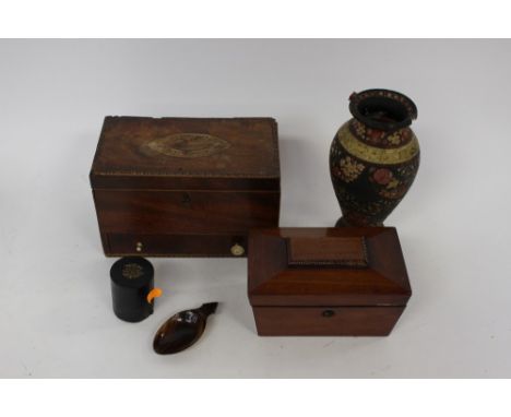 A cased singer sewing machine with a mahogany tea caddy and inlaid sewing box (in need of restoration) a paper mache painted 
