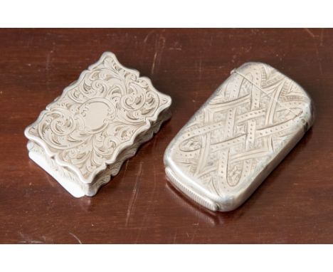 A Victorian silver vinaigrette, minus grill, chased scrolling foliate decoration, Thomas Dones, Birmingham 1854; together wit