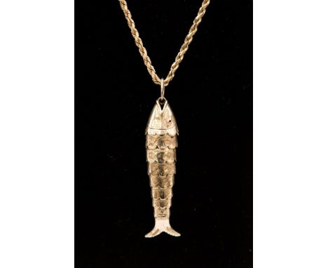 A 9ct articulated fish on a chain, with ruby set eyes - approx length of fish 8 cm - chain 22 inches approx with  a combined 