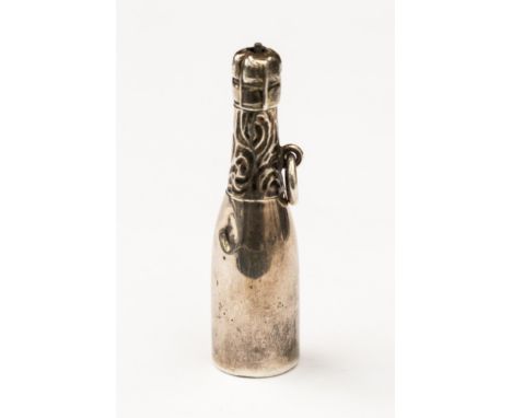A novelty mechanical pencil in the form of a Champagne bottle, by the makers 'Fairchild' unmarked white metal but probably si