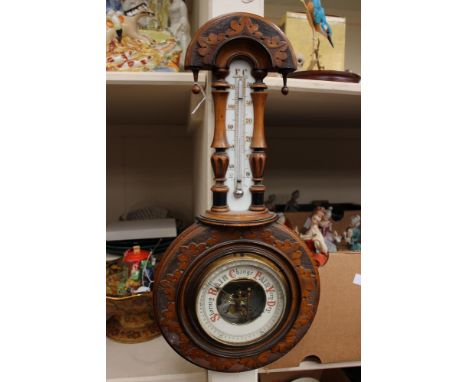 A mahogany wheel barometer having thermometer mounted on original ceramic mount 