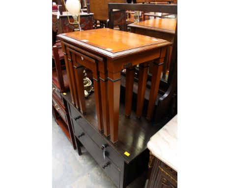 A contemporary cherrywood nest of three tables and a small modern tripod table (4)