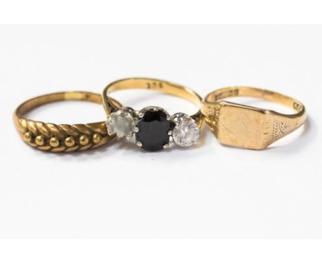 Three gold rings, comprising one 18ct gold and sapphire ring a/f, stones missing, a 9ct gold signet ring, and a yellow metal 