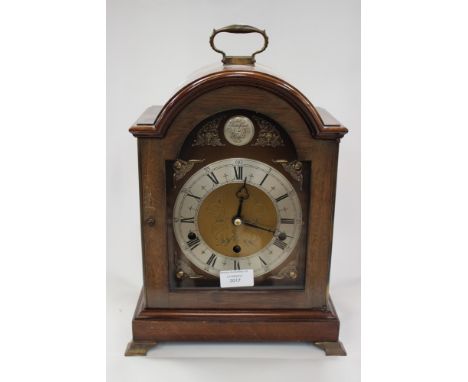 A Georgian style mahogany eight day mantle clock, with three winder holes