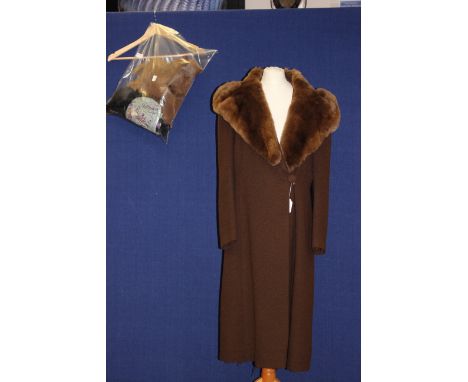 A 1936 dark brown woolen ladies coat with brown rabbit fur collar, fully lined, slim silhouette shape and fastens on the left