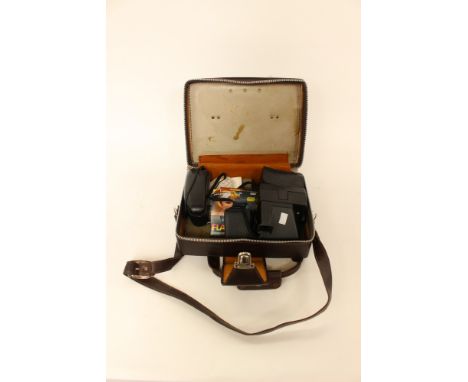 A Polaroid one step 600 camera together with a case, flash 600 bulbs etc 