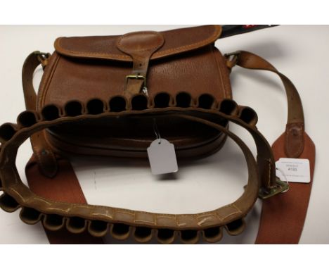 A Cartridge Bag by "Brady of Halesowen": a brown leather cartridge belt for 12 Bore cartridges with brass buckle size "M": tw