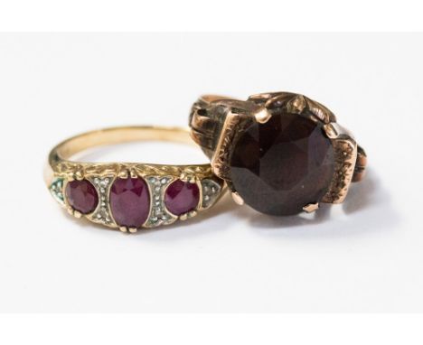 A 9ct gold, ruby and diamond boat ring, featuring three oval rubies and grain set diamonds, ring size P 1/2, weight approx 3.