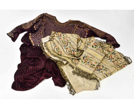 A late 19th century house boys coat from India during the Raj (1858-1947). Embroidered in delicate tambour work in scrolling 