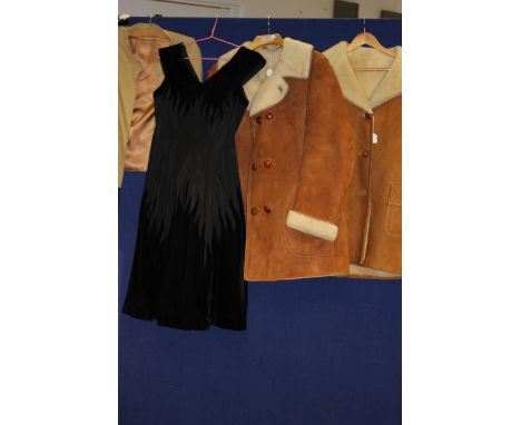 A beige linen mix jacket, 1970 by Peggy French, a black velvet and taffeta cocktail dress with striking pointed work on the b