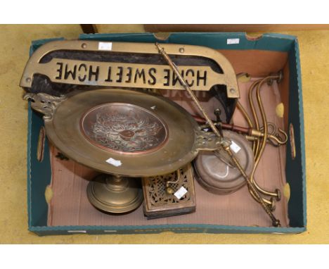A brass fender, brass and copper tazza, brass bait box, set of three mahogany and brass coat hangers, 19th Century gilt brass