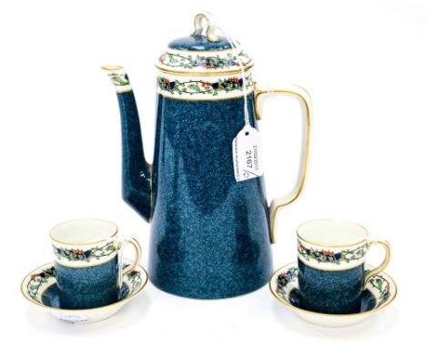 A Royal Worcester coffee pot, with two coffee cups and saucers, made for Waring and Gillow, Oxford Street, London, pattern No