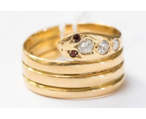 An 18ct gold diamond and ruby serpent ring, set with ruby eyes and diamonds to the head, approx  diamond weight .45ct, the ri