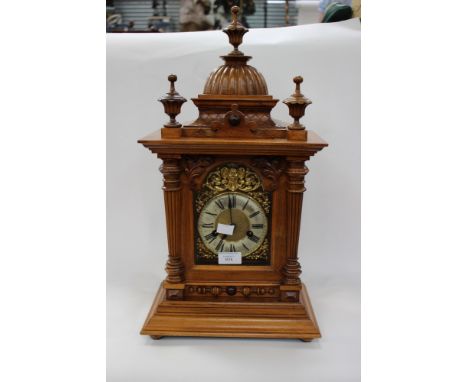 Oak cased eight day mantle clock, with gilt metal decoration around the dial, carved colour detailing (1) (key and pendulum i