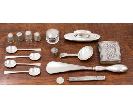 A collection of hallmarked silver items, including miniature Bible, lead holder, spoons, caddy spoon, four thimbles, etc (one