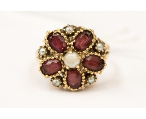 A 9ct gold, tourmaline and pearl flower cluster ring, comprising five oval pink tourmaline's with interspersed pearls, ring s