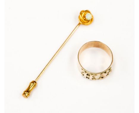 A yellow metal ring weighing approx 6.4 grams, with a yellow metal stick pin, set with an opal (one bag) 