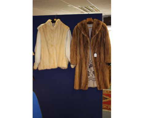 An above knee length Canadian mink coat, Kahnart Furs, embroidered lining with hidden pocket, with a cream leather jacket, ha