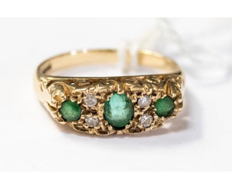 An Emerald and diamond boat ring in  9ct gold, size M, with a  total gross weight 2.8 grams 