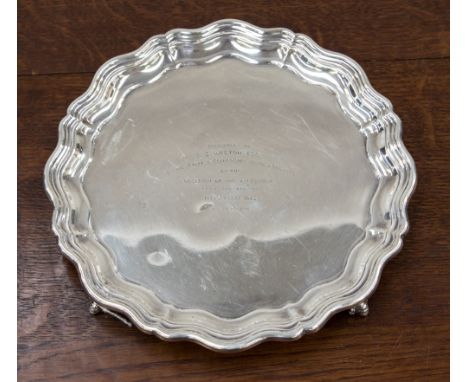 An engraved silver James Dixon presentation tray, ball and claw feet, Sheffield 1944, manufacturer stamp JD & S, weighing app