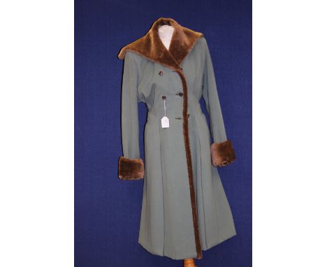 A sage green woman's coat, dating from the mid 1940s with brown faux fur collar and turnback cuffs, double breasted and faste