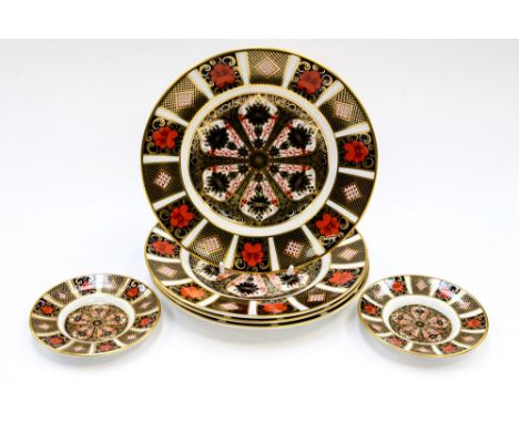 Four Royal Crown Derby Imari 1128 pattern plates (two being seconds) with two Imari 1128 pattern saucers (6) 