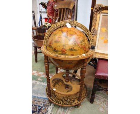 A 20th Century drinks globe, the middle split and opening to reveal an internal drinks section