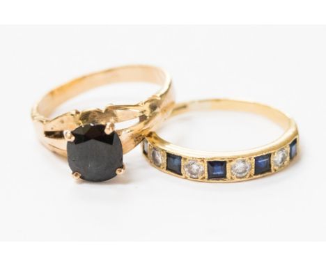 An 18ct gold sapphire and diamond half eternity ring; together with a yellow metal sapphire ring (2) size N and J½ 