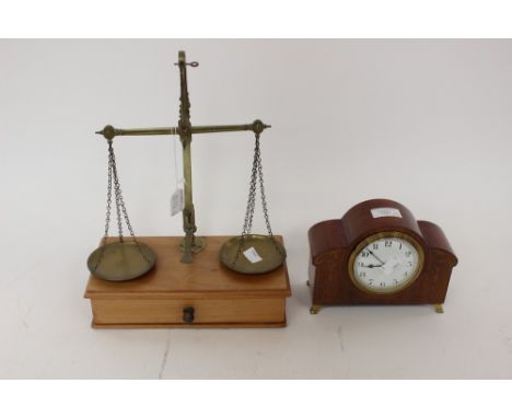 A pair of brass weighing scales, weights in troy oz included, with a mantle clock, Arabic numerals (2) 