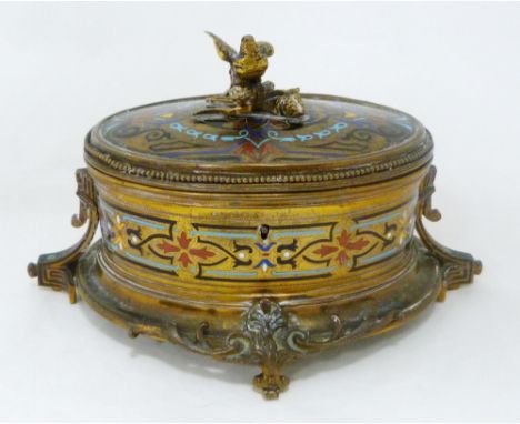French champlevé and gilt metal oval jewellery box, c. early 20th century, with bird surmount on stump to the cover, foliate 