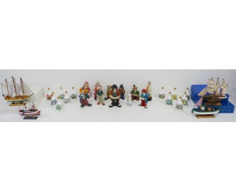 Collection of painted wood and resin clown figures, some musical-themed examples, a collection of Danbury Mint porcelain bell