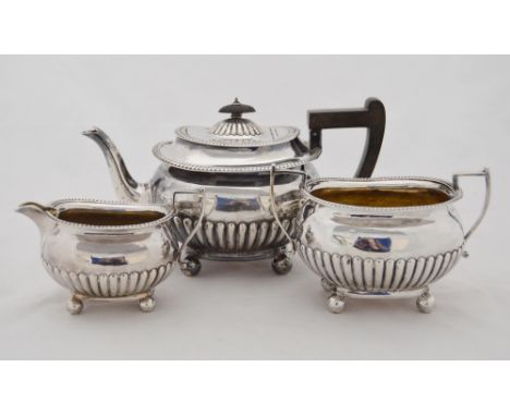 Victorian silver three-piece bachelor's tea service with gadrooned decoration, comprising a teapot, sugar and cream, by Marti