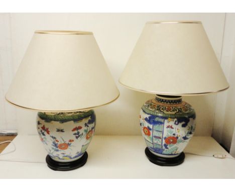 Pair of Chinese Wucai vase lamps of large baluster form, probably Republic period, with all over geometric polychrome panels 