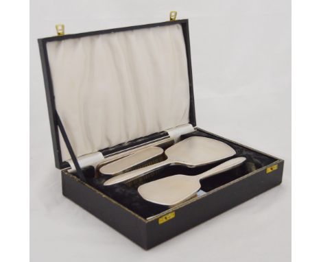 Silver-backed lady's four-piece dressing table set, comprising an engine-turned hand mirror, brush, comb and clothes brush, b