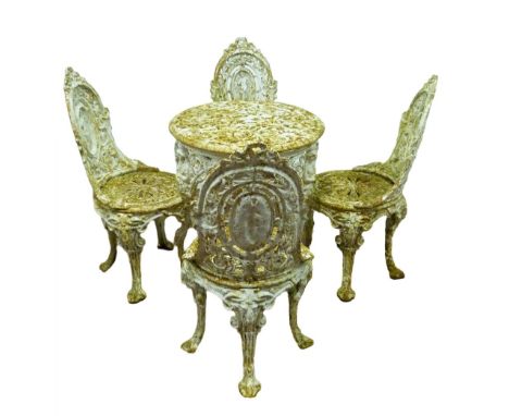 In the Manner of Coalbrookdale Heavy painted iron garden suite comprising a circular table decorated with lion mask appliqués