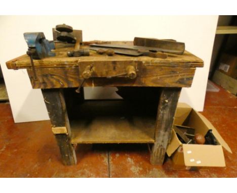 Vintage pine work bench with attached metal vice, and a collection of tools to include saws, one example by Parnall &amp; Son