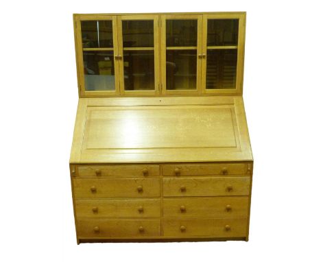 Ercol-style golden oak bureau cabinet, the superstructure top with two pairs of glazed doors enclosing a shelved interior abo