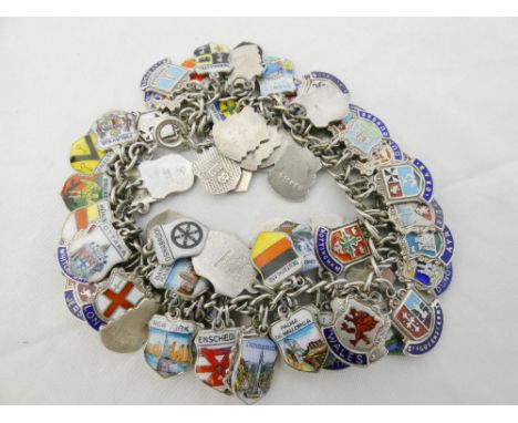 Sterling silver (925) and enamel bracelet set with multiple enamel crested pendants of mainly Scottish and English towns, 104
