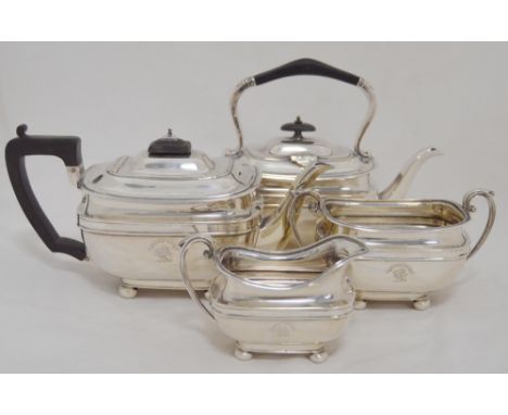 Silver three-piece tea service in the Georgian taste comprising a teapot, sugar and cream, crested to the obverse, by Harriso