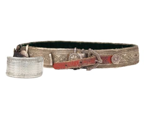 A Persian white-metal belt, early 20th century. Length 69cm and a white-metal bangle. (2)