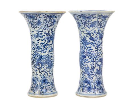A pair of Chinese blue and white gu vases, Kangxi period. Restored, height 20cm, diameter 11cm. (2)Heavy restoration to each 