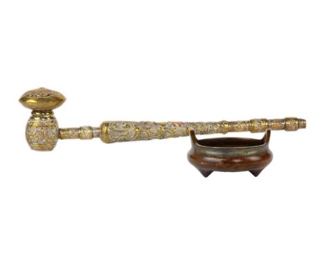 A Chinese bronze censer. With seal mark, height 4.5cm, width 9cm and a Chinese brass pipe, length 32cm. (2)