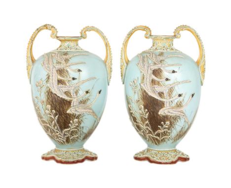 A pair Japanese Noritake porcelain vases, early 20th century. Decorated in relief with geese in flight, mark to base, height 