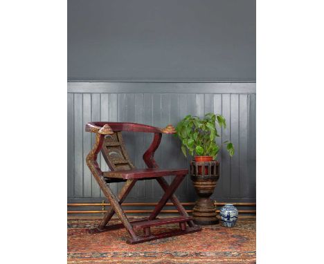 A Chinese ox bow chair, mid 20th century. With gilt decorated pierced splat, above a red lacquer seat and foot rest, height 8