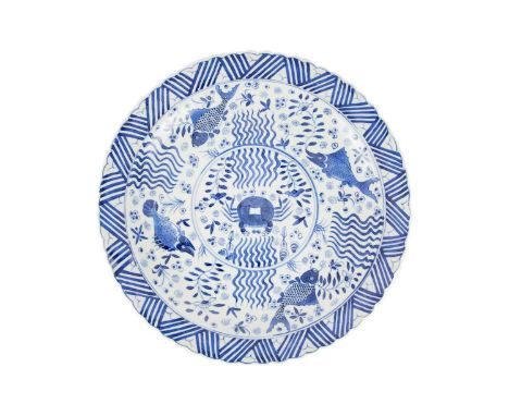 A Chinese blue and white porcelain plate, late 19th century. The central circular medallion enclosing a crab, flanked by four