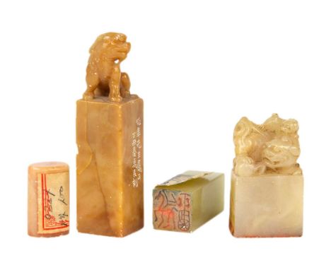 A Chinese carved jade seal. Surmounted by a dog of fo, height 4cm, width 2.5cm, depth 1.5cm; a Chinese jade seal, of rectangu