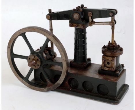 A well engineered part complete stationary beam engine comprising of single vertical cylinder, powering a large spoked flywhe