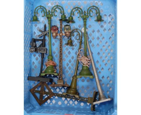 A small plastic tray of Lionel accessories including Railroad Crossing No. 140 (G) double lamp standard No. 76 (F), Railroad 