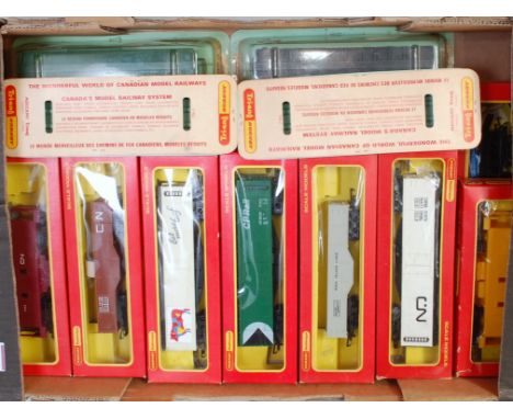 Tray containing 18 Triang Hornby TC series freight cars, 14 in window boxes and 4 in blister packs for the French Canadian ma